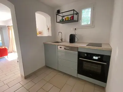 a kitchen with a sink and a stove at La maison en couleurs 3 étoiles, du calme à 10 minutes d'Avignon in Vedène
