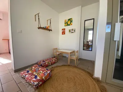a living room with a couch and a table at La maison en couleurs 3 étoiles, du calme à 10 minutes d'Avignon in Vedène