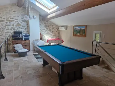 a living room with a pool table in it at La maison de Campagne - RENDEZ-VOUS EN PROVENCE in Monteux