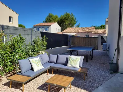 a patio with a couch and a table and a bench at Pleasant detached villa with private swimming pool for 6 people in Lauris - Luberon. in Lauris