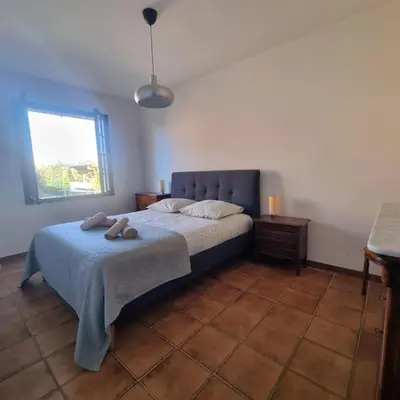 a bedroom with a bed with two teddy bears on it at Villa l'Olivier en Provence 5ch piscine jardin et clim in Lambesc