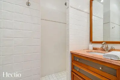 a bathroom with a sink and a mirror at Bastide Domaine Tour Campanets in Le Puy-Sainte-Réparade