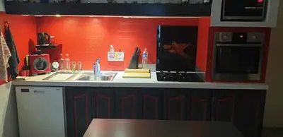 a small kitchen with a sink and a microwave at Chambre étudiant in Morières-lès-Avignon