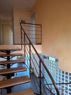 a spiral staircase in a room with a building at La gloriette in Saumane-de-Vaucluse