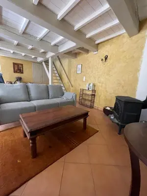 a living room with a couch and a coffee table at maison familiale in Saint-Trinit
