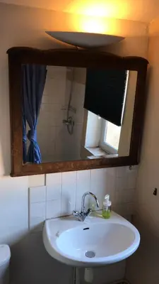 a bathroom with a sink and a mirror at Le Perchoir in Mérindol