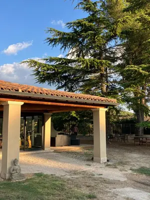 a pavilion at a park with a tree at Mazet des Cèdres au pied de la colline in Lagnes