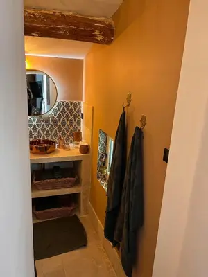 a bathroom with a sink and a mirror at Le Mas d'Emilienne in Coudoux