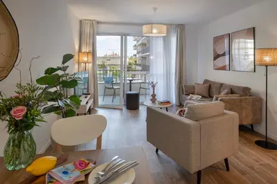 a living room with a couch and a table at DOMITYS - L'Amandier in Aix-en-Provence