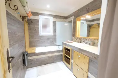 a bathroom with a sink and a mirror at Air-conditioned house with heated pool, Luberon, in Maubec – 6 people in Maubec