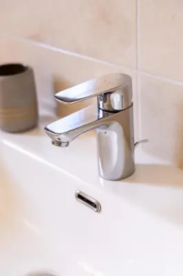 a bathroom with a toilet and a sink at La Villa Sable en Provence in Saint-Saturnin-les-Apt