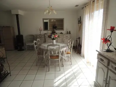 a kitchen with a table and chairs in a room at Villa au calme in Eyguières