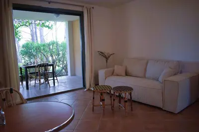 a living room with a couch and a table at Gîte Confortable Vue Exceptionnelle - Golf de Saumane in Saumane-de-Vaucluse