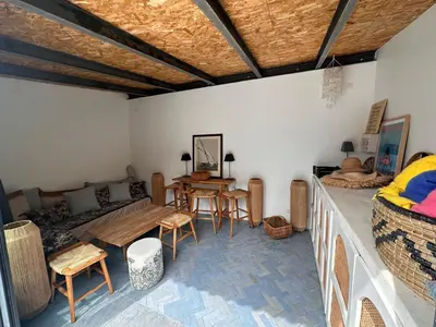 a living room with a couch and a table at Divine Idylle Luxe 3 chambres, terrasse 130m2, jacuzzi, Clim 5 m Cours Mirabeau in Aix-en-Provence
