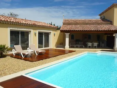 a swimming pool in front of a house at Gite de charme avec piscine dans le Luberon in Cavaillon