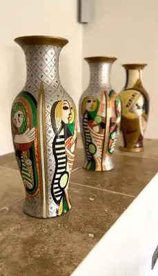 a row of vases sitting on top of a counter at Le Clos de Yann in Gordes