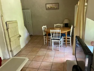 a room with a bunk bed and a dresser and a desk at gîte à Rustrel in Rustrel