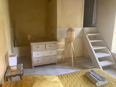 a room with a ladder in a room at gîte à Rustrel in Rustrel