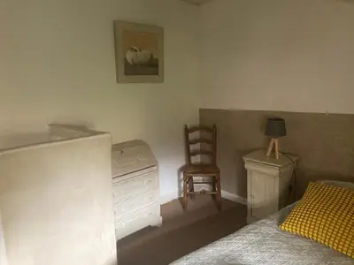 a bedroom with a bed with blue towels on it at gîte à Rustrel in Rustrel