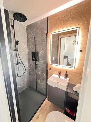 a bathroom with a shower and a sink at La Villa Rustica in Aix-en-Provence