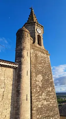 a tall tower with a clock on top of it at Charming & medieval village house completely renovated with great exterior and views in Mallemort