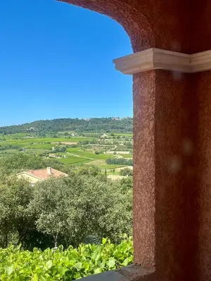 a view of a field from a window of a building at Là où le Ciel est né Beau mas pierres et contemporain sur grande propriété vue Mont Ventoux dentelles de Montmirail in Blauvac