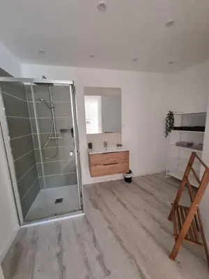 a bathroom with a glass shower and a sink at Maison de village avec terrasse in Grans