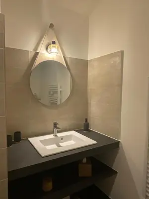 a bathroom with a sink and a mirror at Mas la Floreline in Cheval-Blanc