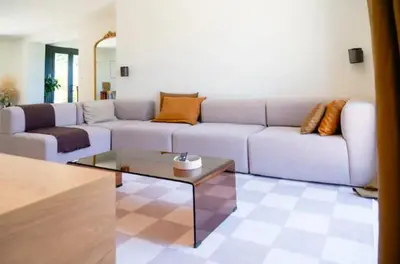 a living room with a couch and a coffee table at Maison familiale avec piscine in Aix-en-Provence