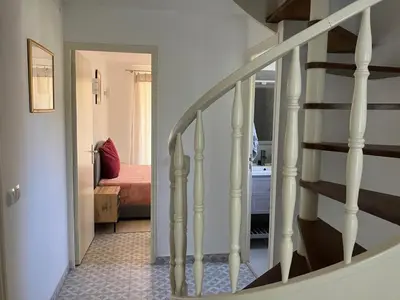 a stairway leading to a room with a bedroom at Villa Paradis des Oréades in Lauris