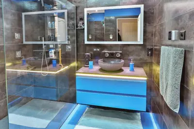 a bathroom with a sink and a mirror at La Maison Bleue in LʼIsle-sur-la-Sorgue