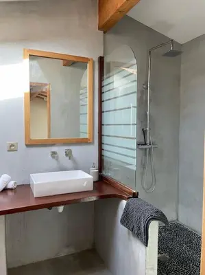 a bathroom with a sink and a mirror at Bergerie de charme proche Aix en Provence et Lubéron in Rognes