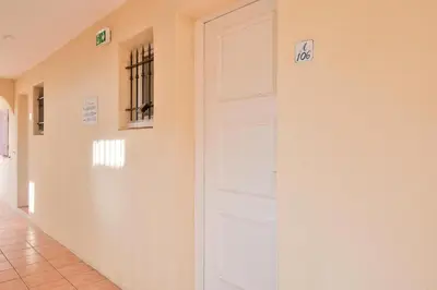 a door in a hallway with exit signs on it at Village Pont Royal en Provence - maeva Home - Appartement moderne et climatisé 2 pièces 4 personnes - Prestige - super Home MAE-0581 in Mallemort