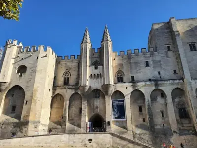 a castle with a blue sky in the background at Borie en Provence in Velleron