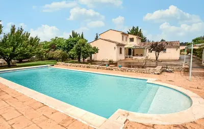 a swimming pool in front of a house at Amazing Home In Beaumont-De-Pertuis in Beaumont-de-Pertuis