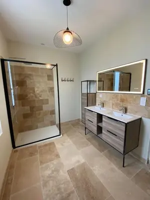 a bathroom with a shower and a sink and a mirror at Camargu'Alpilles in Mollégès