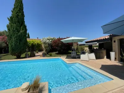 a swimming pool in the backyard of a house at Studio Le Pitchoun in Pernes-les-Fontaines