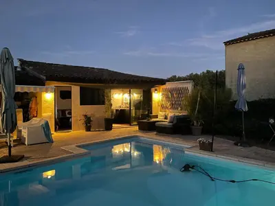 a swimming pool in front of a house at Studio Le Pitchoun in Pernes-les-Fontaines