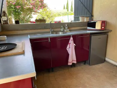 a kitchen with a sink and a counter with a towel at Studio Le Pitchoun in Pernes-les-Fontaines