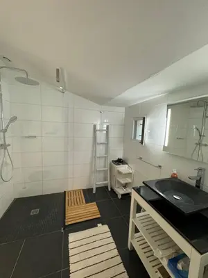 a bathroom with a sink and a mirror at Les Feuilleres in LʼIsle-sur-la-Sorgue