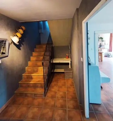 a staircase in a house with a bench on it at Villa face au Mont Ventoux avec bassin in Modène