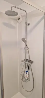 a shower with a shower head in a bathroom at Appartement, 1 chambre, jardin privatif in Venelles