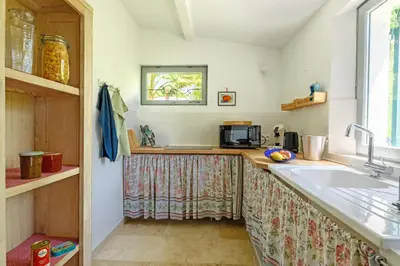 a kitchen with a sink and a counter at Mas de l'Aube in Mouriès