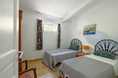 a bedroom with two beds and a window at Mas de l'Aube in Mouriès