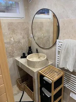 a bathroom with a sink and a mirror at Suite avec sauna in Pertuis