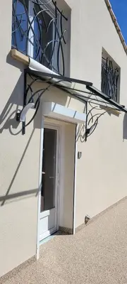 an open door to a building with a window at Le PEROTIN in Villes-sur-Auzon