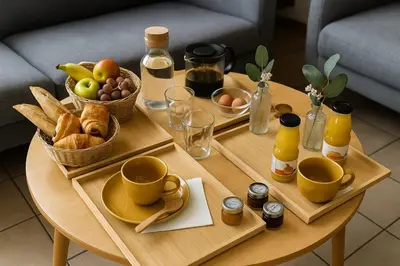 a coffee table with a tray of food and drinks at Maison moderne jardin piscine et parking prives, près d'Aix Centre in Venelles