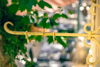 a gold object with a cross hanging from it at Les Suites de l'Étang in Cucuron