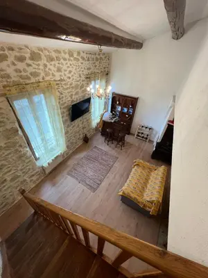 an aerial view of a living room with a couch at Chez Dragos centre ville Lauris in Lauris