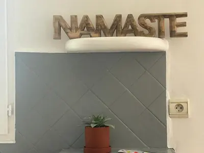 a bedroom with a bed and a window at Namasté in Aix-en-Provence